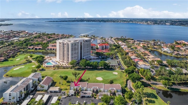 birds eye view of property with a water view