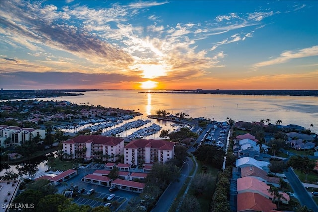 aerial view at dusk with a water view