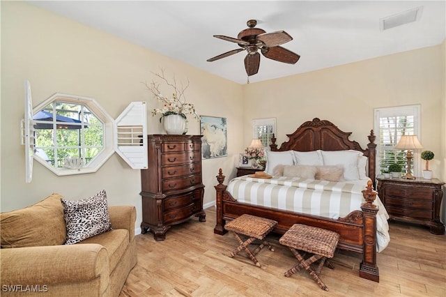 bedroom featuring light hardwood / wood-style floors and ceiling fan