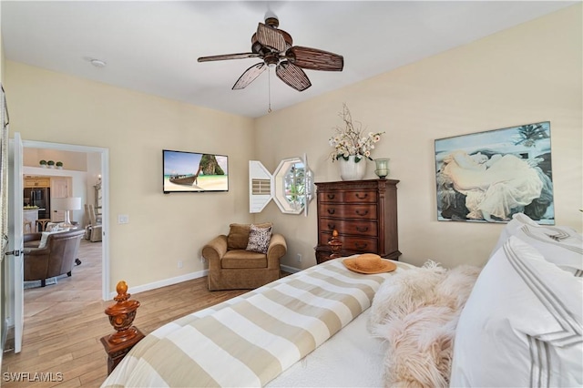 bedroom featuring ceiling fan and light hardwood / wood-style flooring