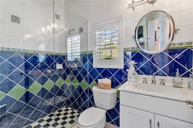 bathroom with vanity, a shower, toilet, and tile walls