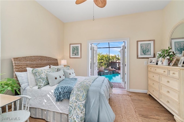 bedroom with access to outside, light hardwood / wood-style flooring, and ceiling fan