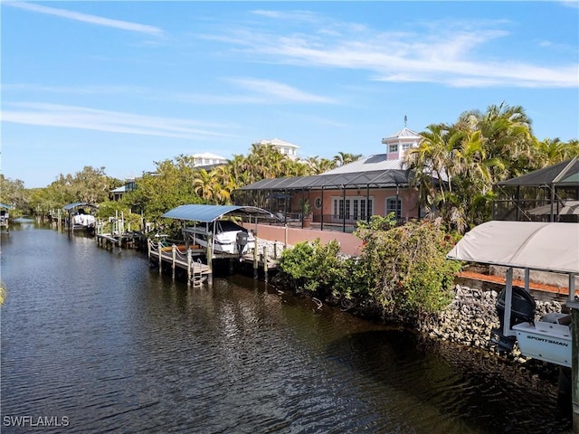 dock area featuring glass enclosure and a water view