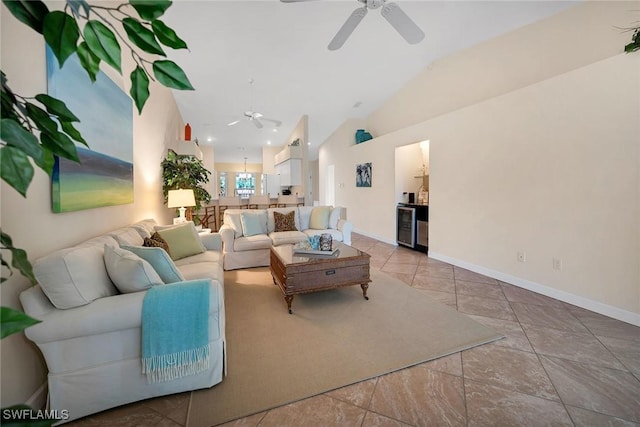 living room with wine cooler, ceiling fan, and lofted ceiling