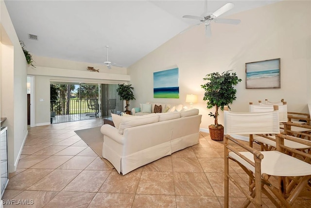 living room with ceiling fan, light tile patterned floors, and high vaulted ceiling