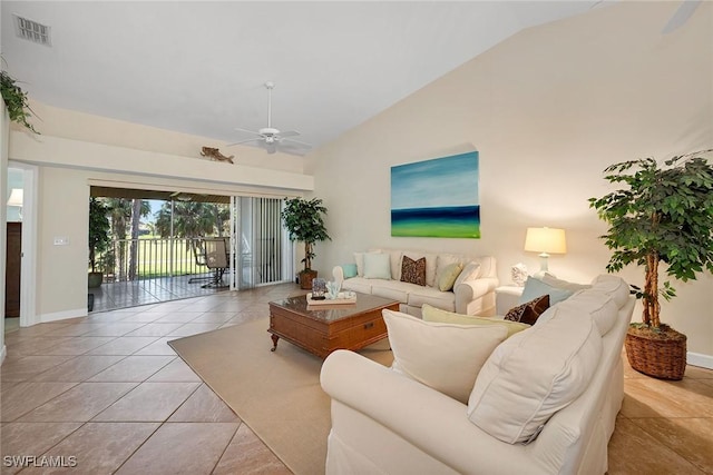 living room featuring vaulted ceiling, ceiling fan, and light tile patterned flooring