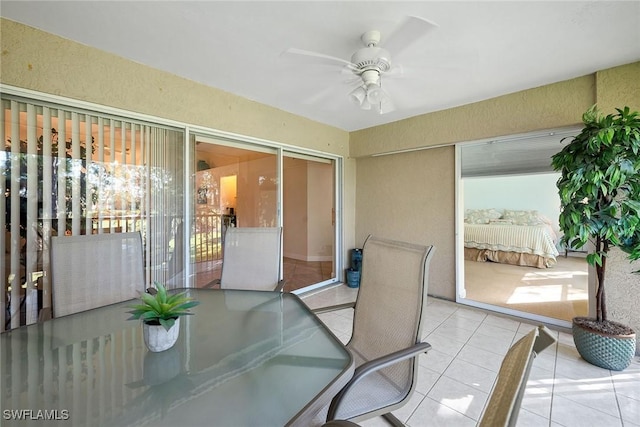 sunroom / solarium featuring ceiling fan and a wealth of natural light