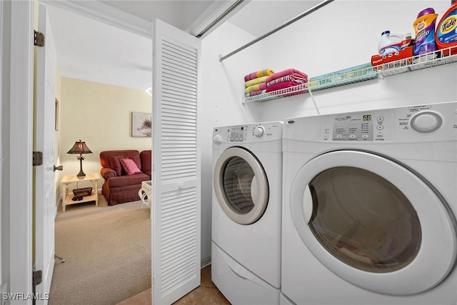 laundry area with carpet and washing machine and dryer