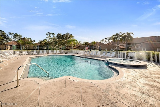 view of pool with a patio area and a community hot tub