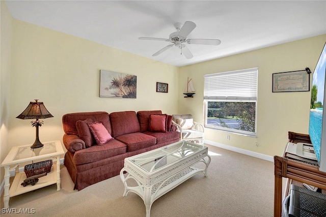 living room featuring ceiling fan and carpet