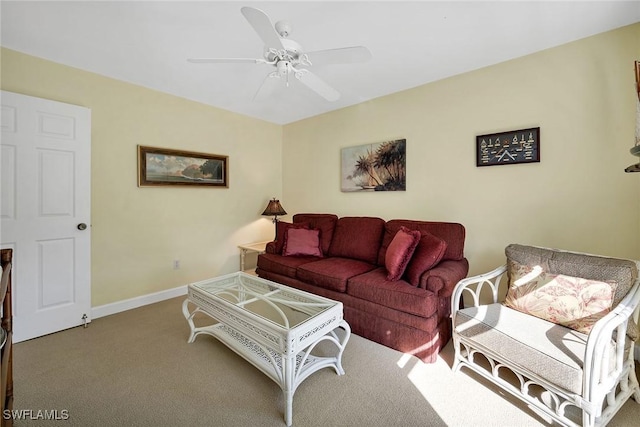 living room with ceiling fan and light colored carpet