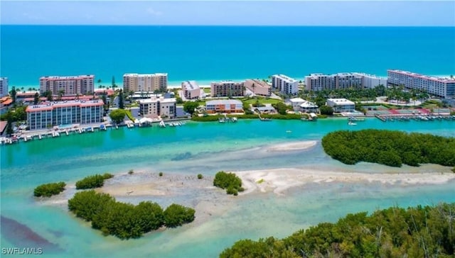 aerial view featuring a water view and a beach view