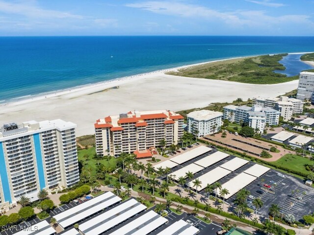 bird's eye view with a beach view and a water view