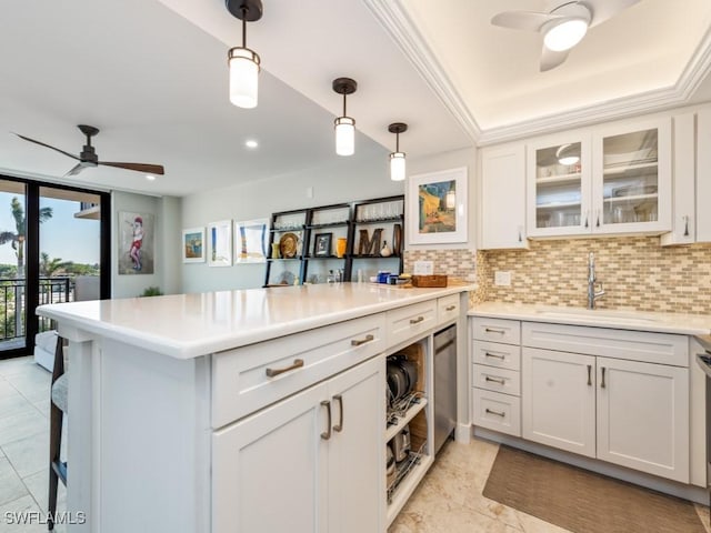 180 Seaview Ct Unit 504, Marco Island, FL 34145 - kitchen with a ceiling fan, a peninsula, decorative backsplash, white cabinetry, and recessed lighting