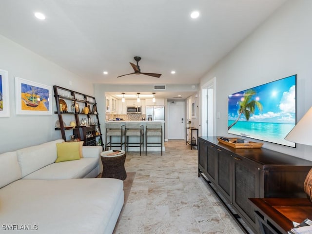 180 Seaview Ct Unit 504, Marco Island, FL 34145 - living room featuring a ceiling fan and recessed lighting