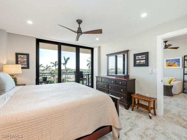 bedroom featuring access to exterior, ceiling fan, french doors, and a wall of windows