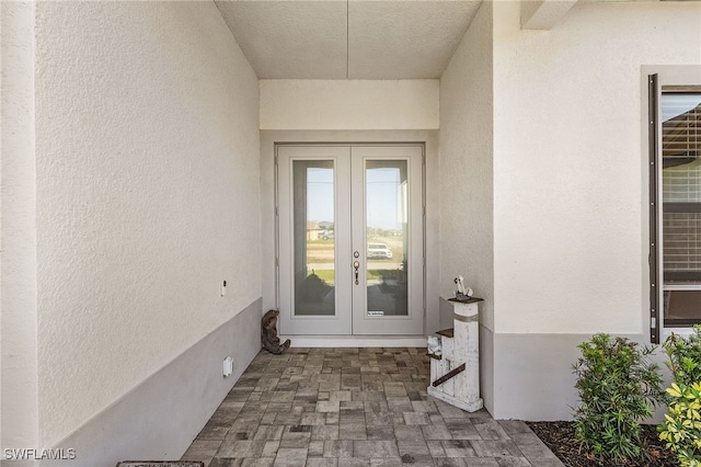 property entrance featuring french doors