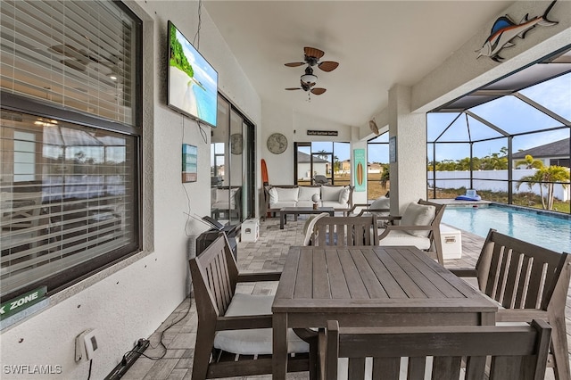 view of patio featuring ceiling fan, a lanai, and an outdoor hangout area