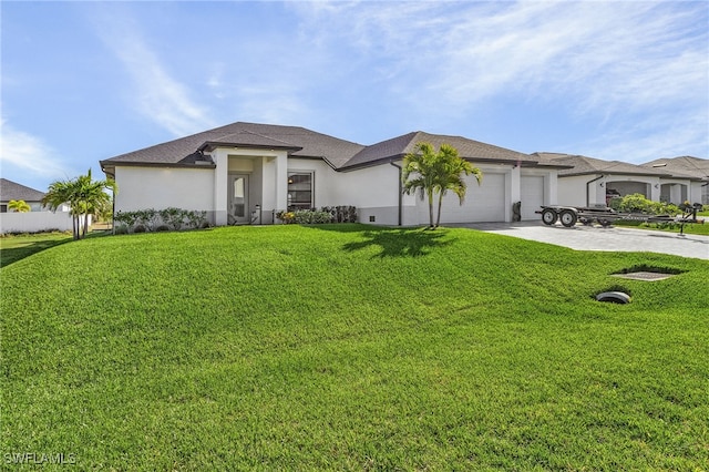 view of front of home with a garage and a front lawn