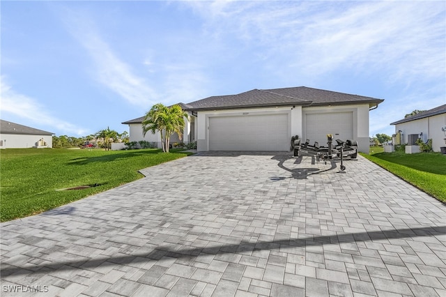 view of front of property with a garage and a front yard