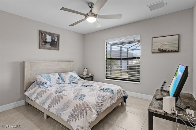 tiled bedroom with ceiling fan