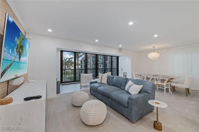 living room featuring a notable chandelier and light colored carpet