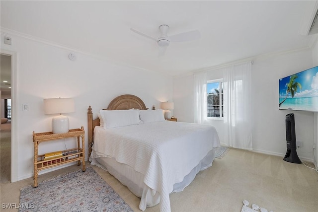 bedroom with ceiling fan, ornamental molding, and light carpet