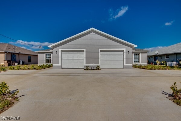 ranch-style home featuring a garage