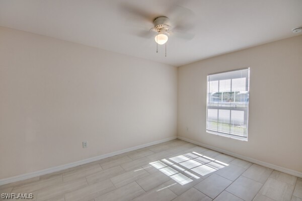 unfurnished room with ceiling fan