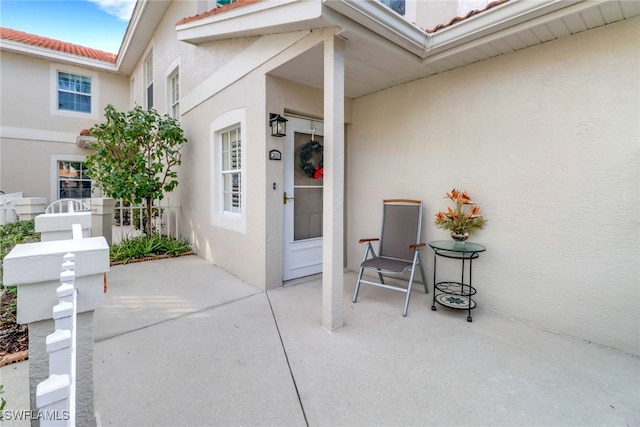 entrance to property with a patio area