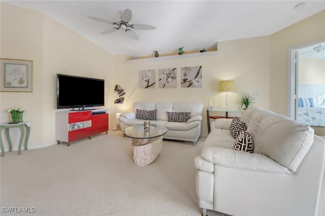 carpeted living room featuring ceiling fan and lofted ceiling