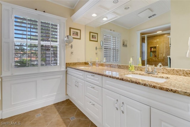 bathroom featuring lofted ceiling, tile patterned flooring, vanity, and an enclosed shower