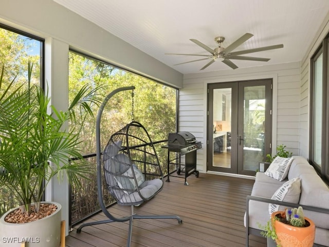 sunroom with french doors and ceiling fan