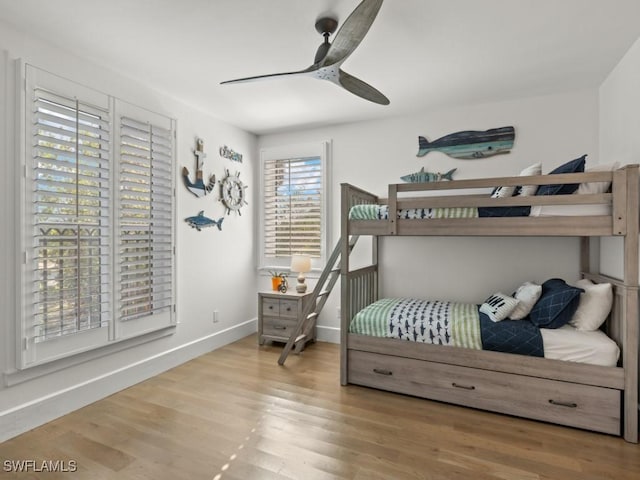 bedroom with ceiling fan and light hardwood / wood-style flooring