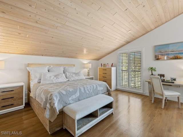 bedroom with wood-type flooring, vaulted ceiling, and wood ceiling