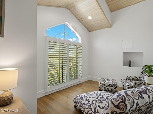 sitting room with light hardwood / wood-style flooring, lofted ceiling, and wood ceiling