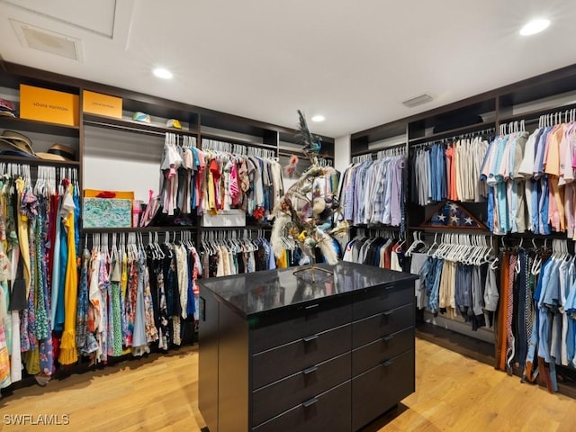 walk in closet featuring light wood-type flooring