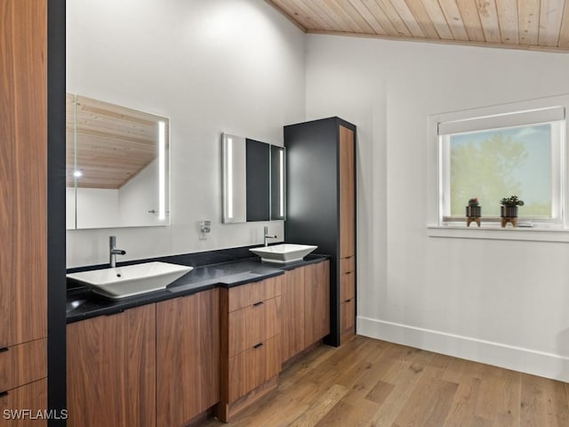 bathroom featuring vanity, wooden ceiling, lofted ceiling, and wood-type flooring