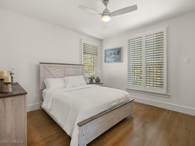 bedroom featuring ceiling fan and dark wood-type flooring