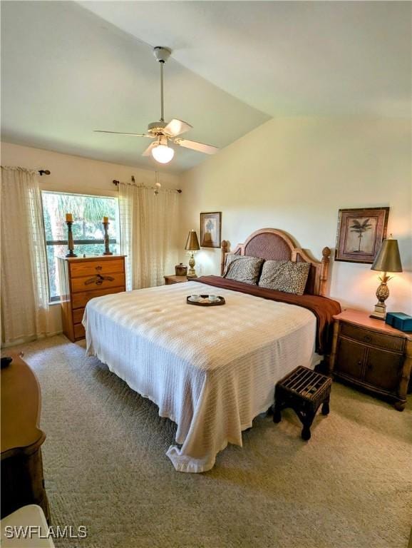 carpeted bedroom with ceiling fan and lofted ceiling