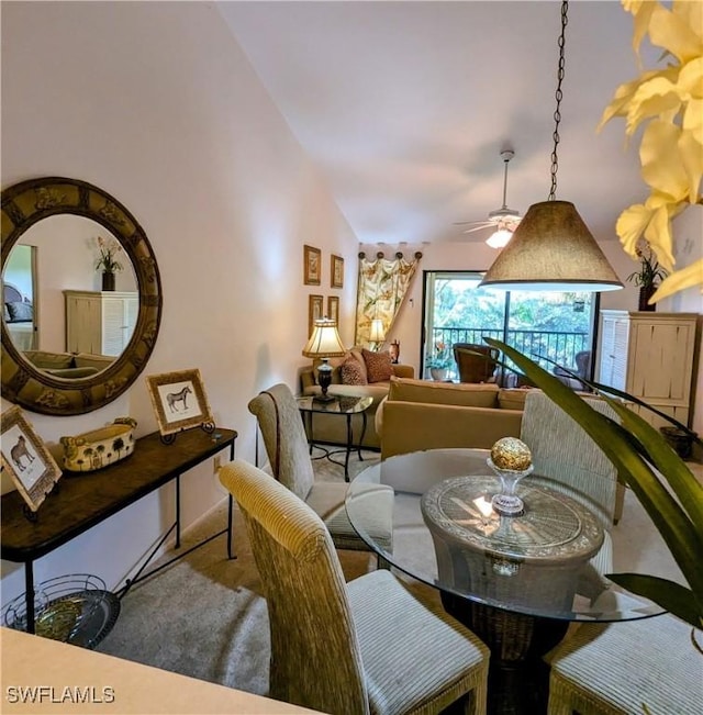 dining room featuring ceiling fan and lofted ceiling