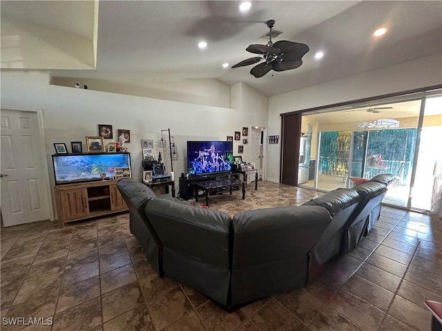 living room with ceiling fan and vaulted ceiling