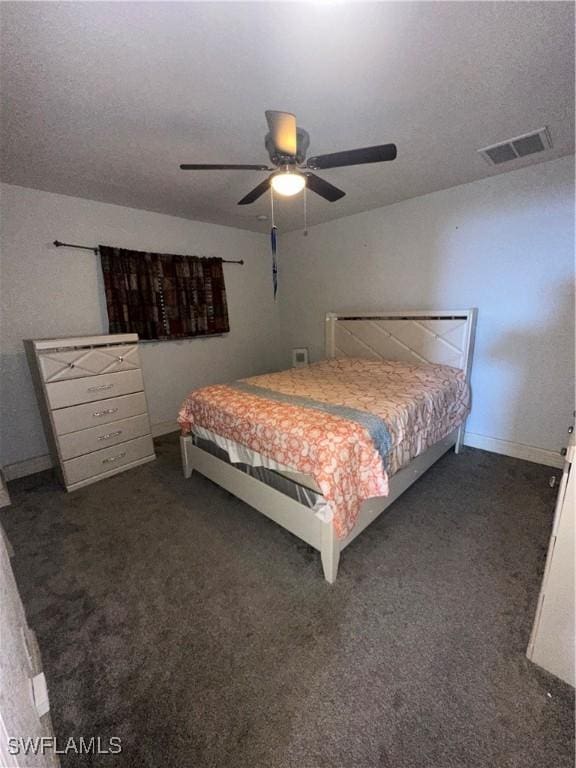 bedroom with dark colored carpet and ceiling fan