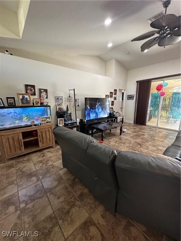 living room featuring ceiling fan and vaulted ceiling