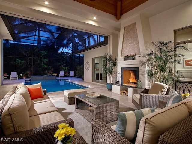 view of swimming pool with pool water feature and a large fireplace