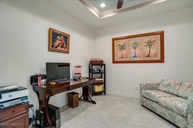 home office featuring a raised ceiling