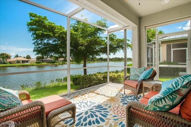 sunroom with a water view