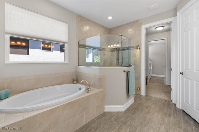 bathroom featuring plus walk in shower