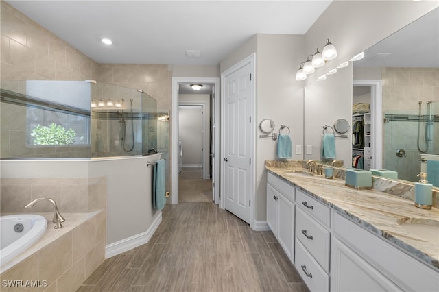 bathroom with vanity and plus walk in shower