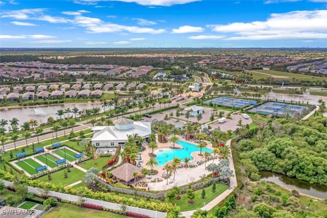 birds eye view of property with a water view